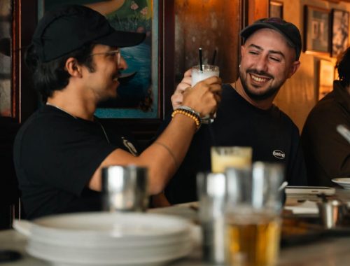 friends toasting drinks in cozy london pub