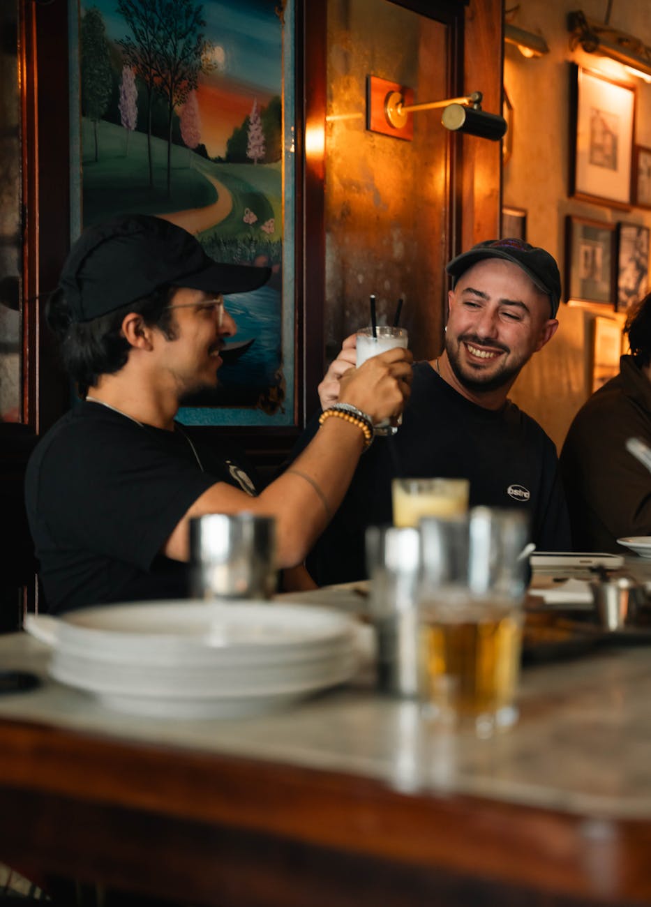 friends toasting drinks in cozy london pub